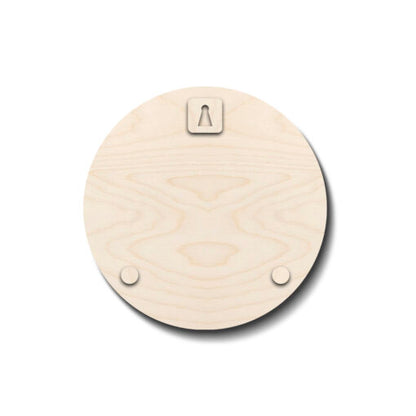 Modern all-wood round family name plate styled on an entrance wall in two tones