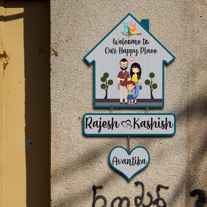 Close-up of lovebirds and welcome text on bird hut family name plate