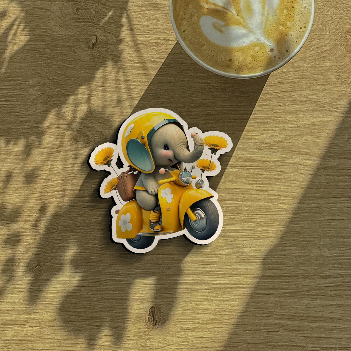 Kids fridge magnet on a clean backdrop showing cartoon baby elephant on yellow Vespa with sunflowers.