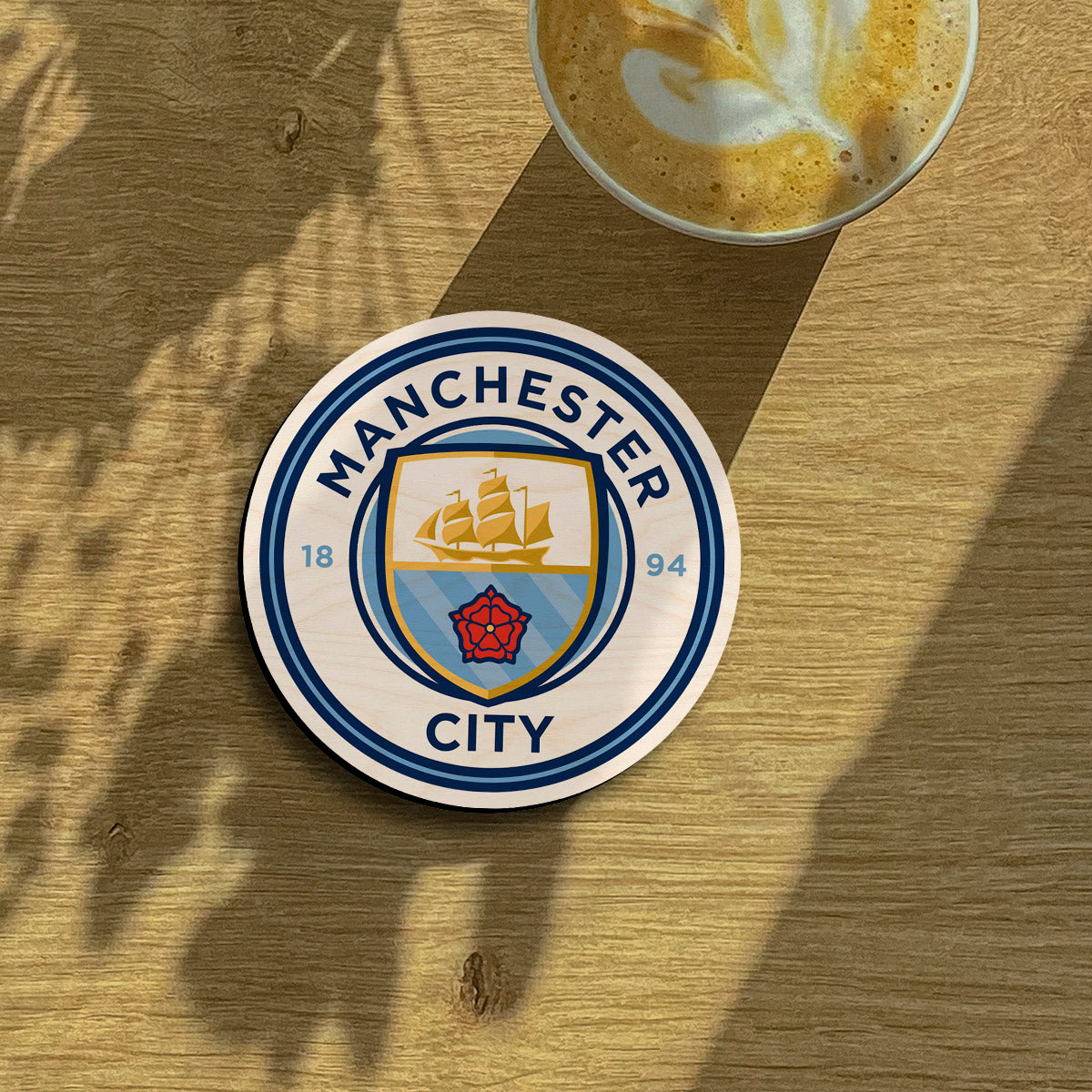 Manchester city fridge magnet on a clean backdrop showing sky-blue ship + red rose roundel with 1894 founding date.