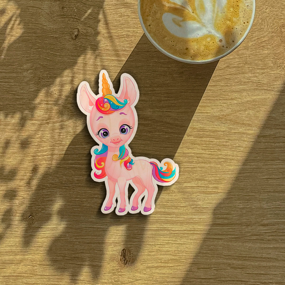 Kids fridge magnet on a clean backdrop showing cartoon unicorn silhouette with rainbow mane and tail.
