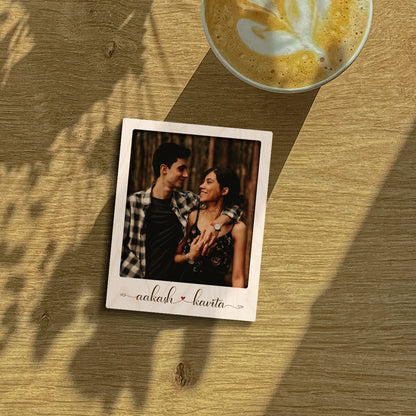 Personalized photo fridge magnet – rectangular polaroid-style birch wood magnet with a printed couple photo and names in cursive, 3x4 inches