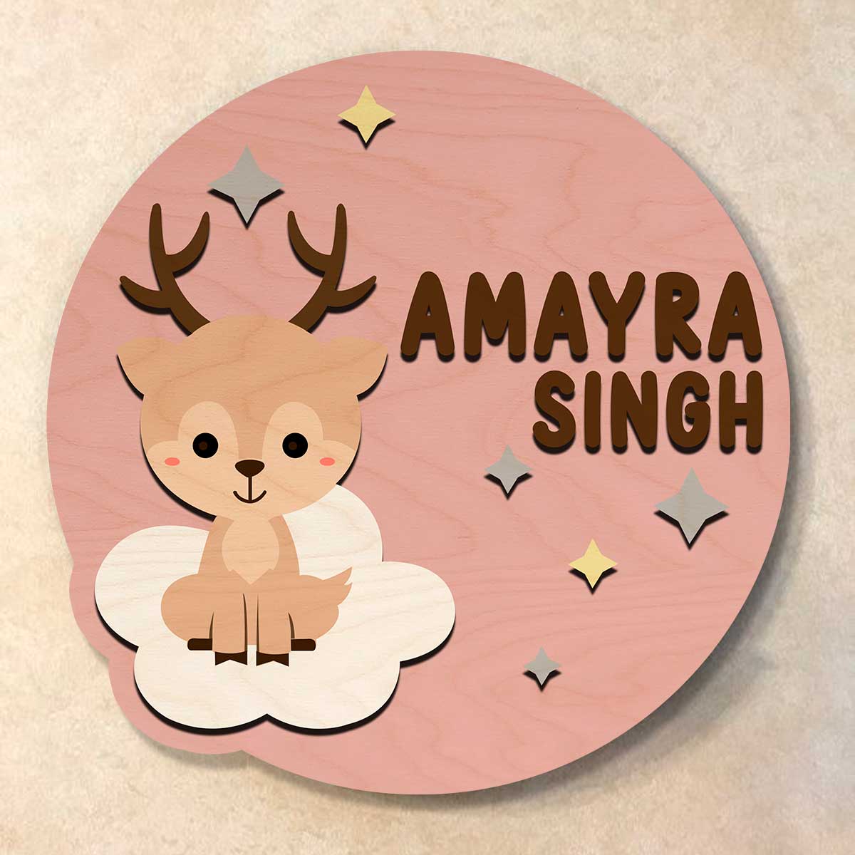 Round pink kids name plate on nursery door with deer, stars and 3D child name