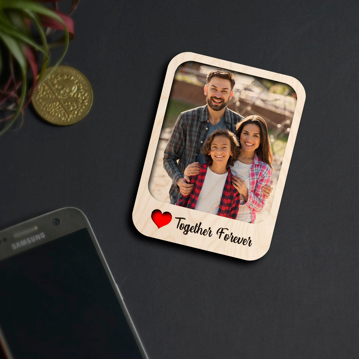 Alternate angle on the couple fridge magnet, showing polaroid with 'Together Forever' cursive, in birch wood.