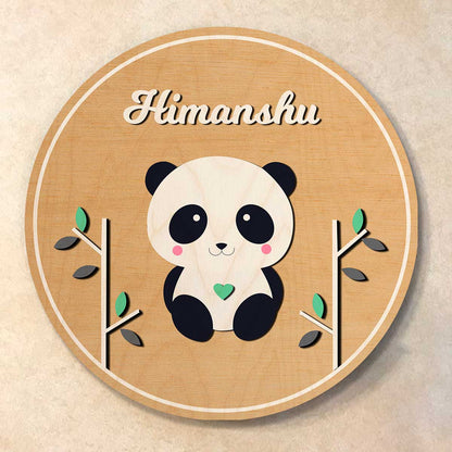 Panda theme name plate with a panda holding a green heart between bamboo stems