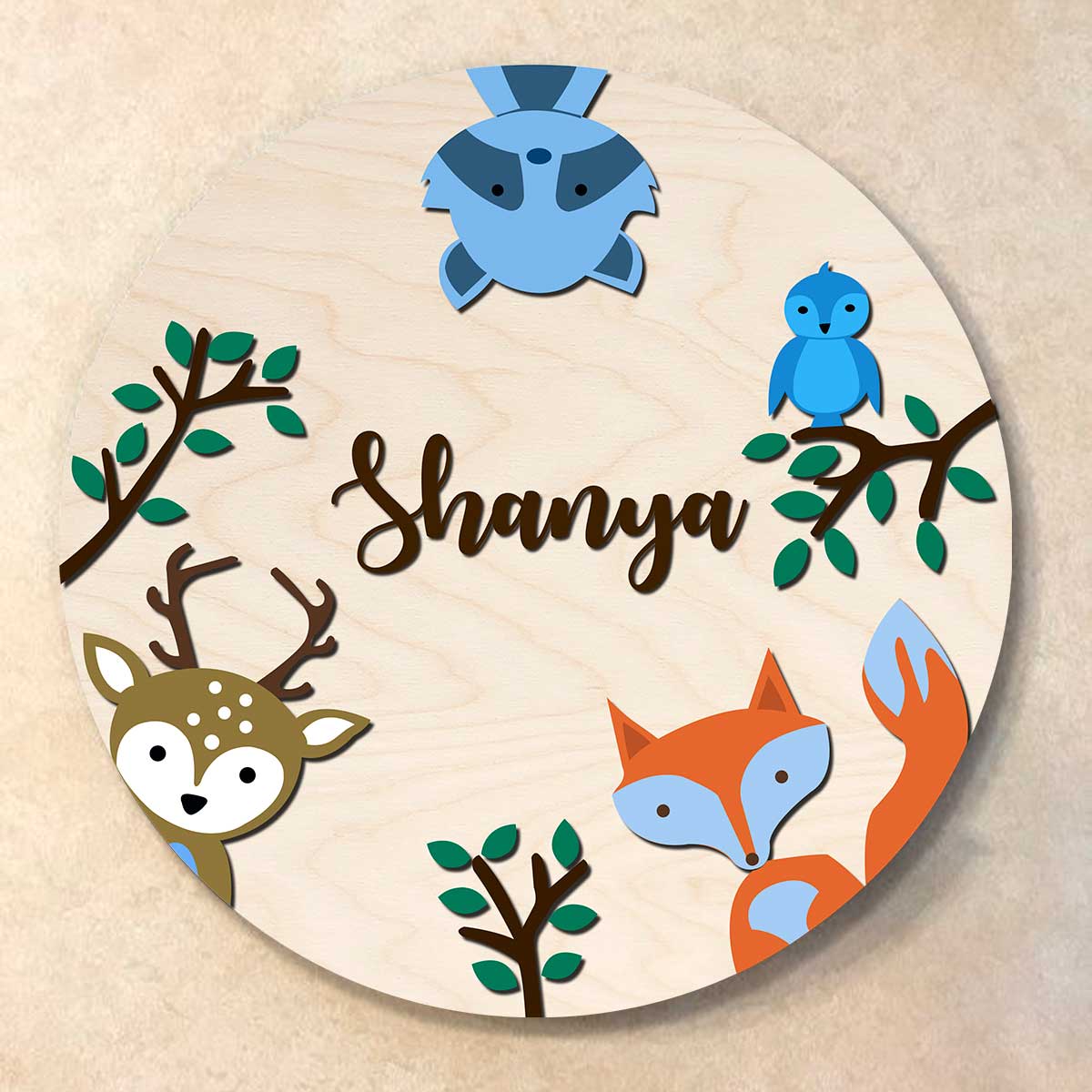 Safari kids name plate with a fox, deer, raccoon and bird around a child's name