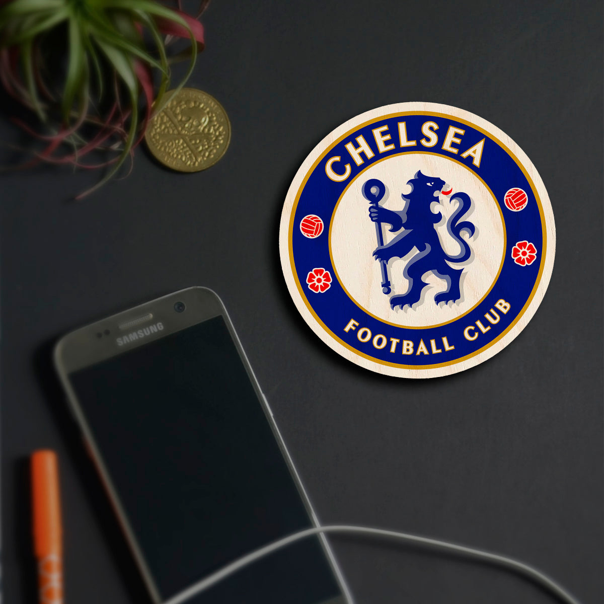Alternate angle on the chelsea fridge magnet, showing chelsea blue rampant lion roundel with gold ring text, in birch wood.
