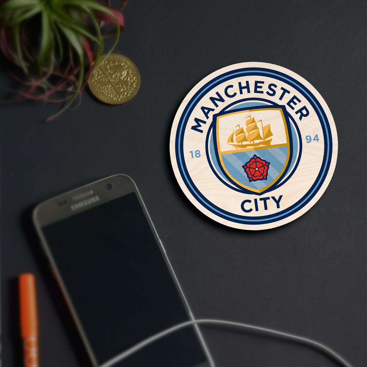 Alternate angle on the manchester city fridge magnet, showing sky-blue ship + red rose roundel with 1894 founding date.