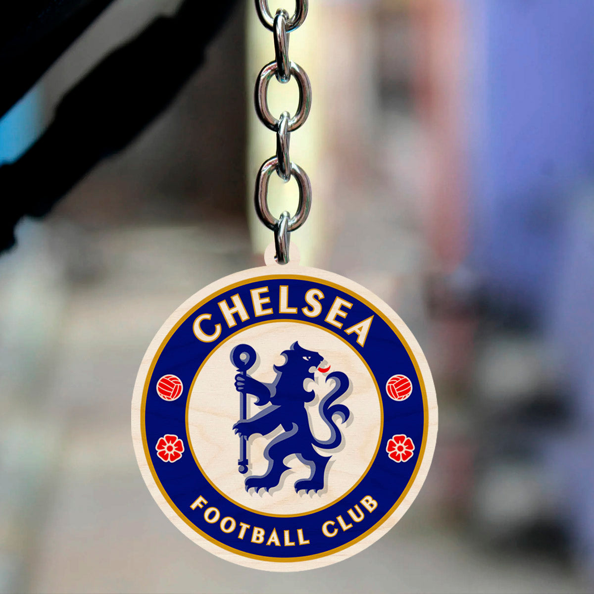 Alternate angle on the football keychain, showing chelsea blue rampant lion roundel with gold ring text.