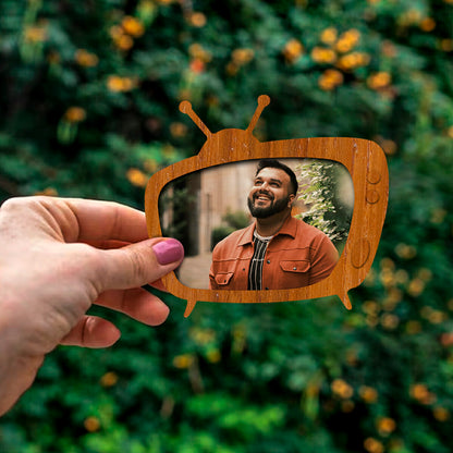 Photo fridge magnet on a clean backdrop showing vintage TV silhouette with antennas.