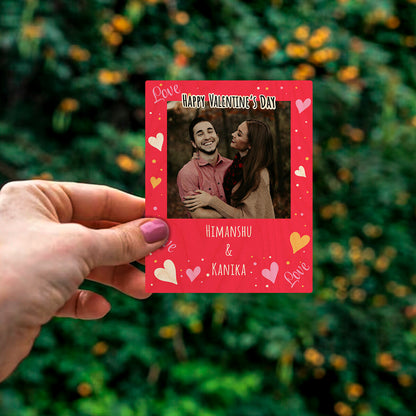 Detail crop of the couple fridge magnet, on birch wood face.