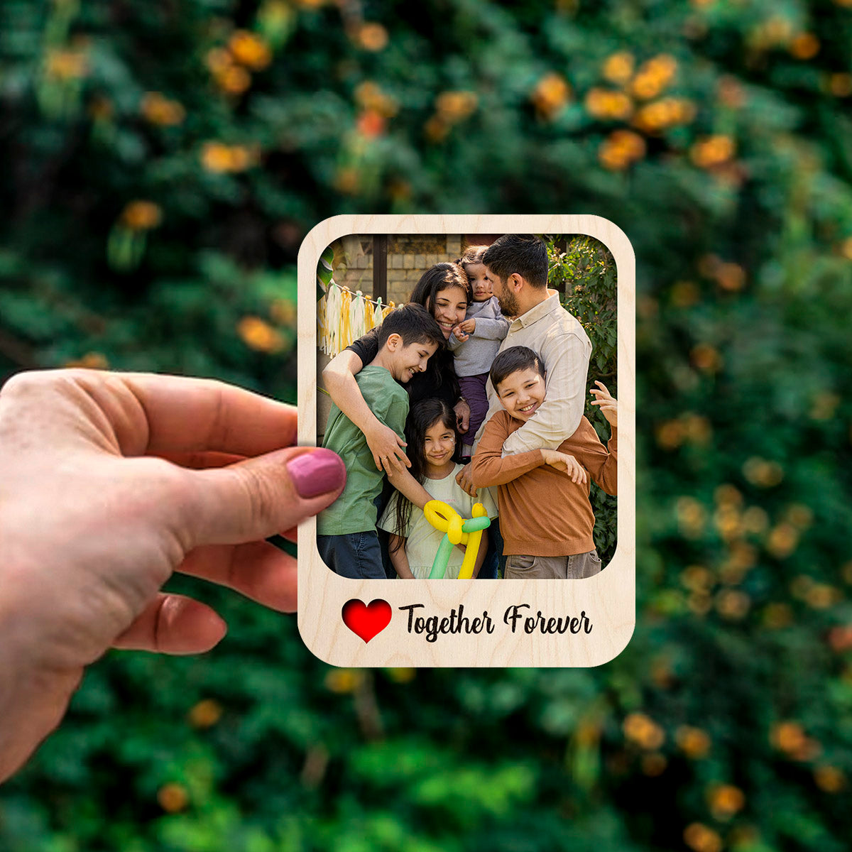 Detail crop of the couple fridge magnet, with polaroid with 'Together Forever' cursive, on birch wood face.