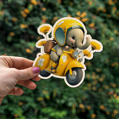 Detail crop of the kids fridge magnet, with cartoon baby elephant on yellow Vespa with sunflowers, on birch wood face.