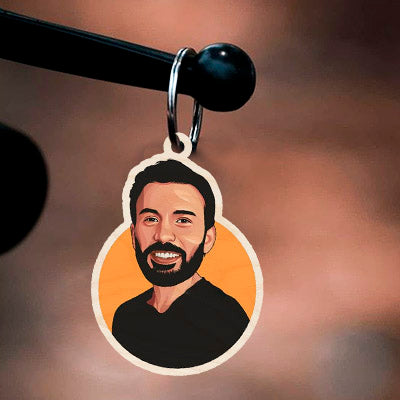 Detail of the marvel keychain, with bearded civilian Steve Rogers (post-Endgame) — NOT suited, in birch wood.