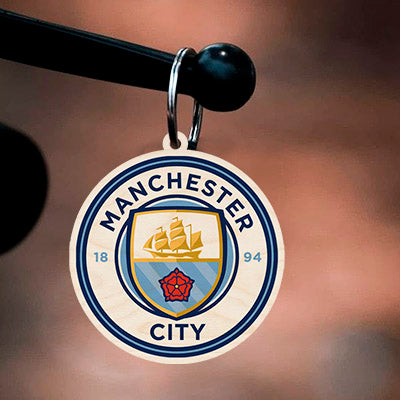 Alternate angle on the football keychain, showing light-blue ship + red rose roundel with 1894 founding date.