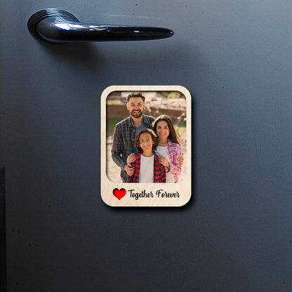 On-fridge lifestyle shot of the couple fridge magnet, showing polaroid with 'Together Forever' cursive.
