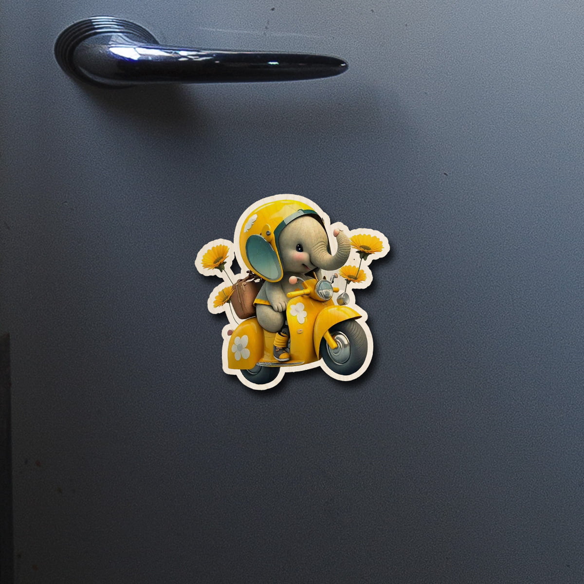 On-fridge lifestyle shot of the kids fridge magnet, showing cartoon baby elephant on yellow Vespa with sunflowers.