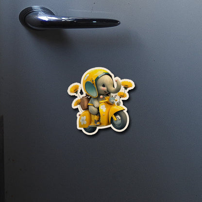 On-fridge lifestyle shot of the kids fridge magnet, showing cartoon baby elephant on yellow Vespa with sunflowers.