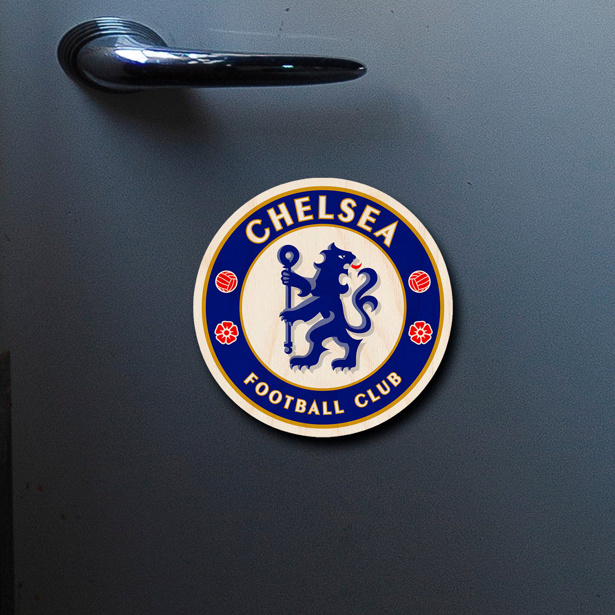 On-fridge lifestyle shot of the chelsea fridge magnet, showing chelsea blue rampant lion roundel with gold ring text.