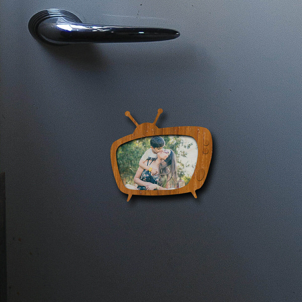 Held in hand for scale, real-world 3x4 inch for this photo fridge magnet, in birch wood.
