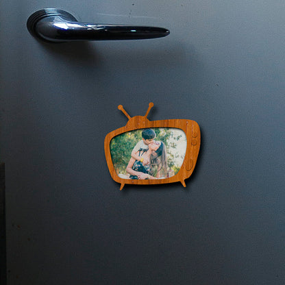 Held in hand for scale, real-world 3x4 inch for this photo fridge magnet, in birch wood.
