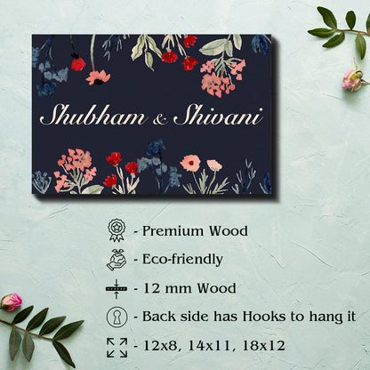 Personalised dark floral couple name plate with couple names in white script on navy