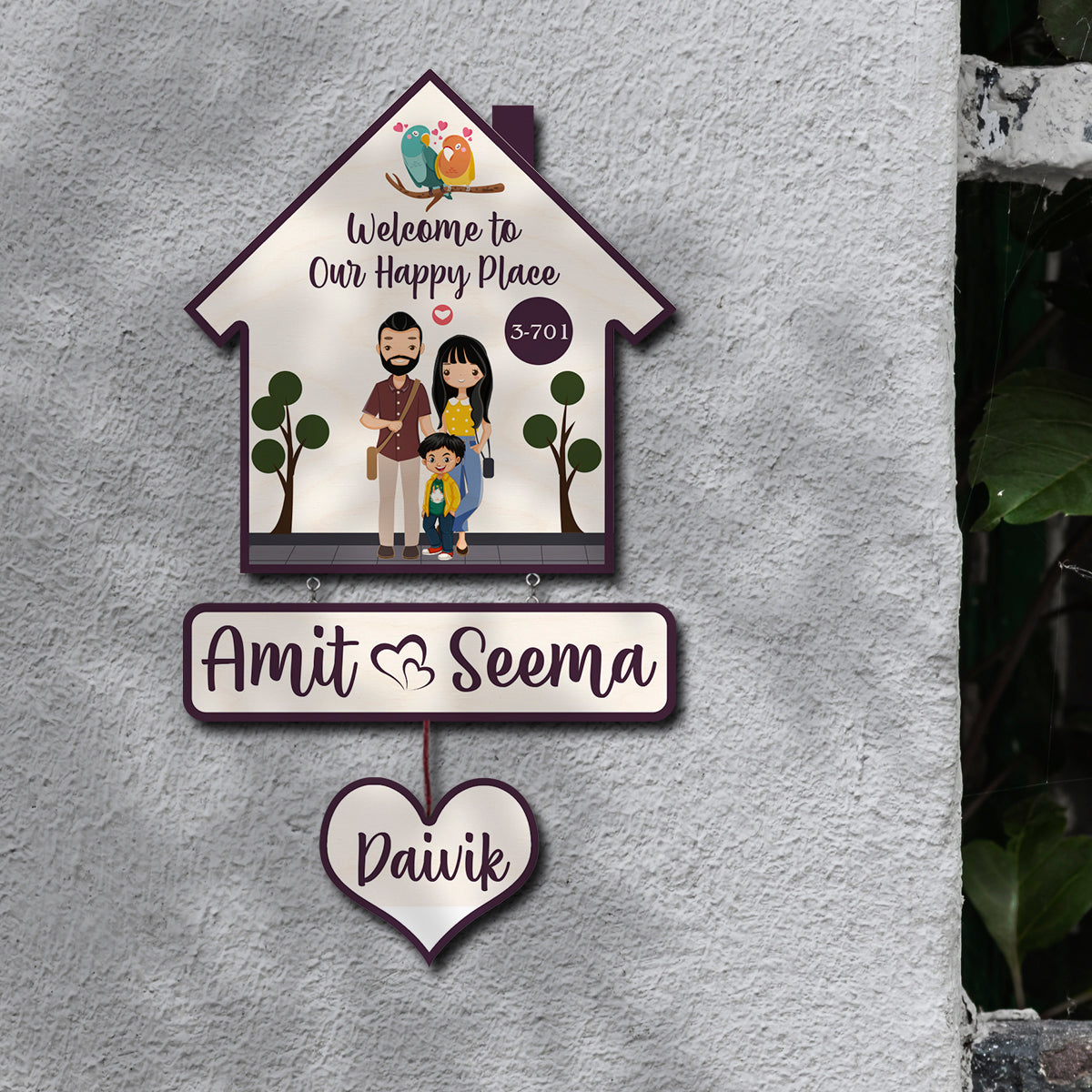 Bird hut family name plate showing house motif and family name arrangement
