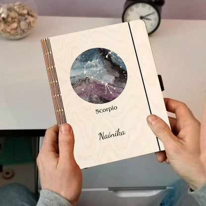 Personalized diary cover on a clean backdrop showing blue-purple nebula with Scorpio constellation curl and.