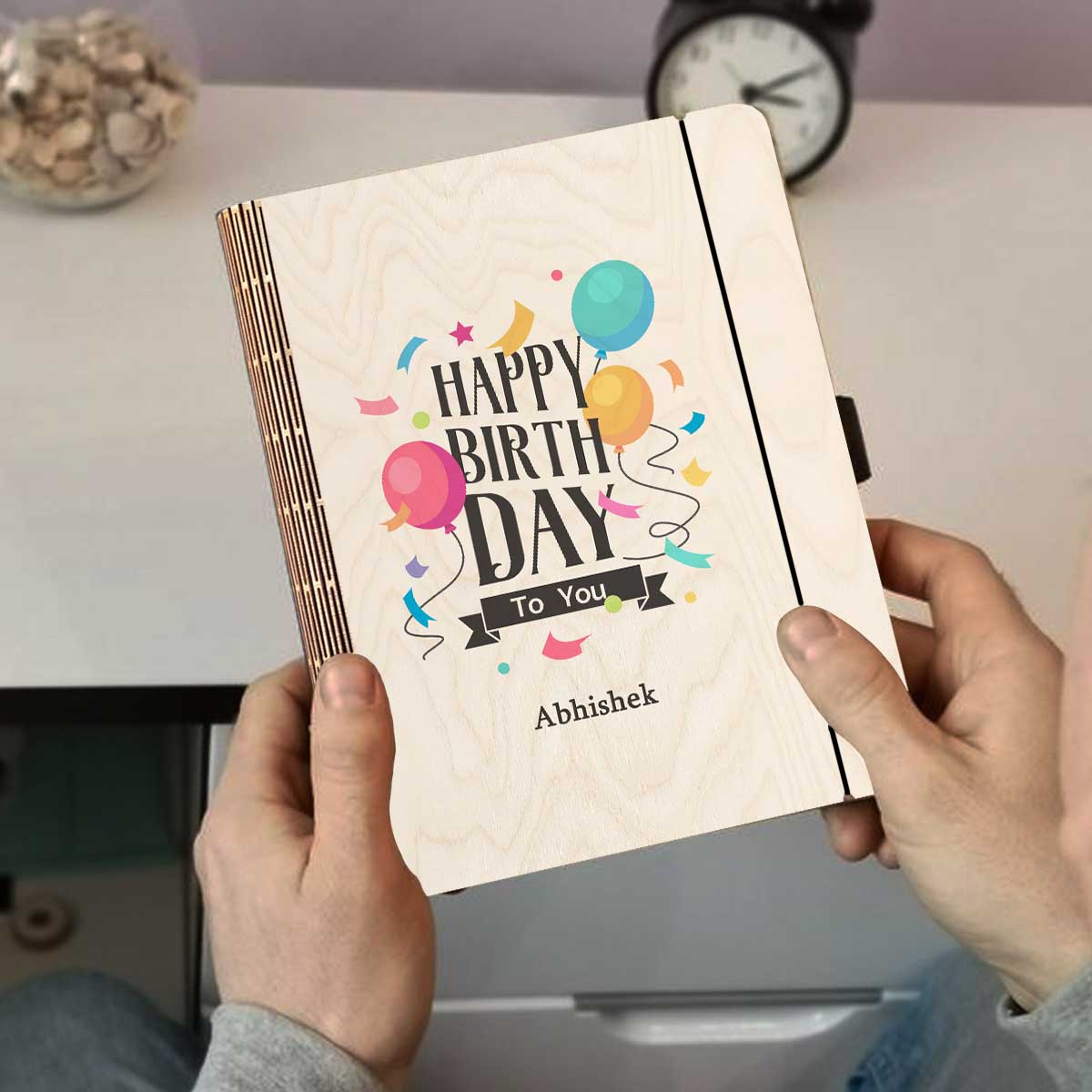 Detail crop on the personalized diary cover, with color-printed balloons + confetti with a custom name slot.