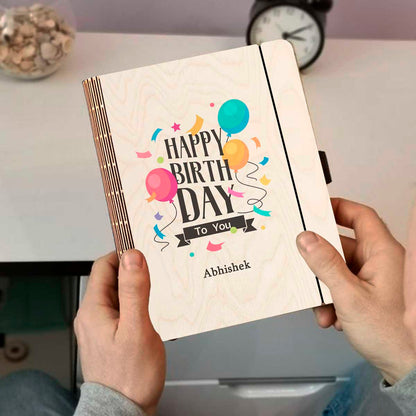 Detail crop on the personalized diary cover, with color-printed balloons + confetti with a custom name slot.