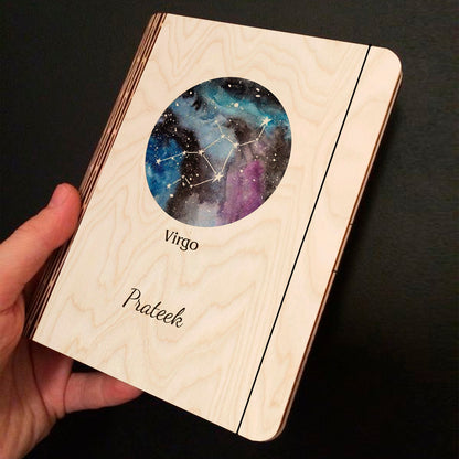 Alternate angle on the personalized diary, showing blue-purple nebula with Virgo constellation and custom name.