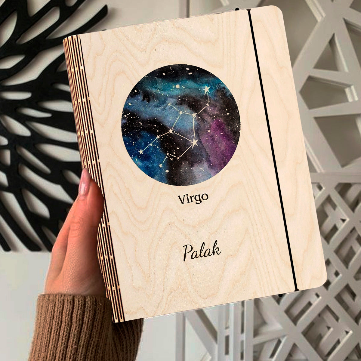 Open spread of the personalized diary, with blue-purple nebula with Virgo constellation and custom name.