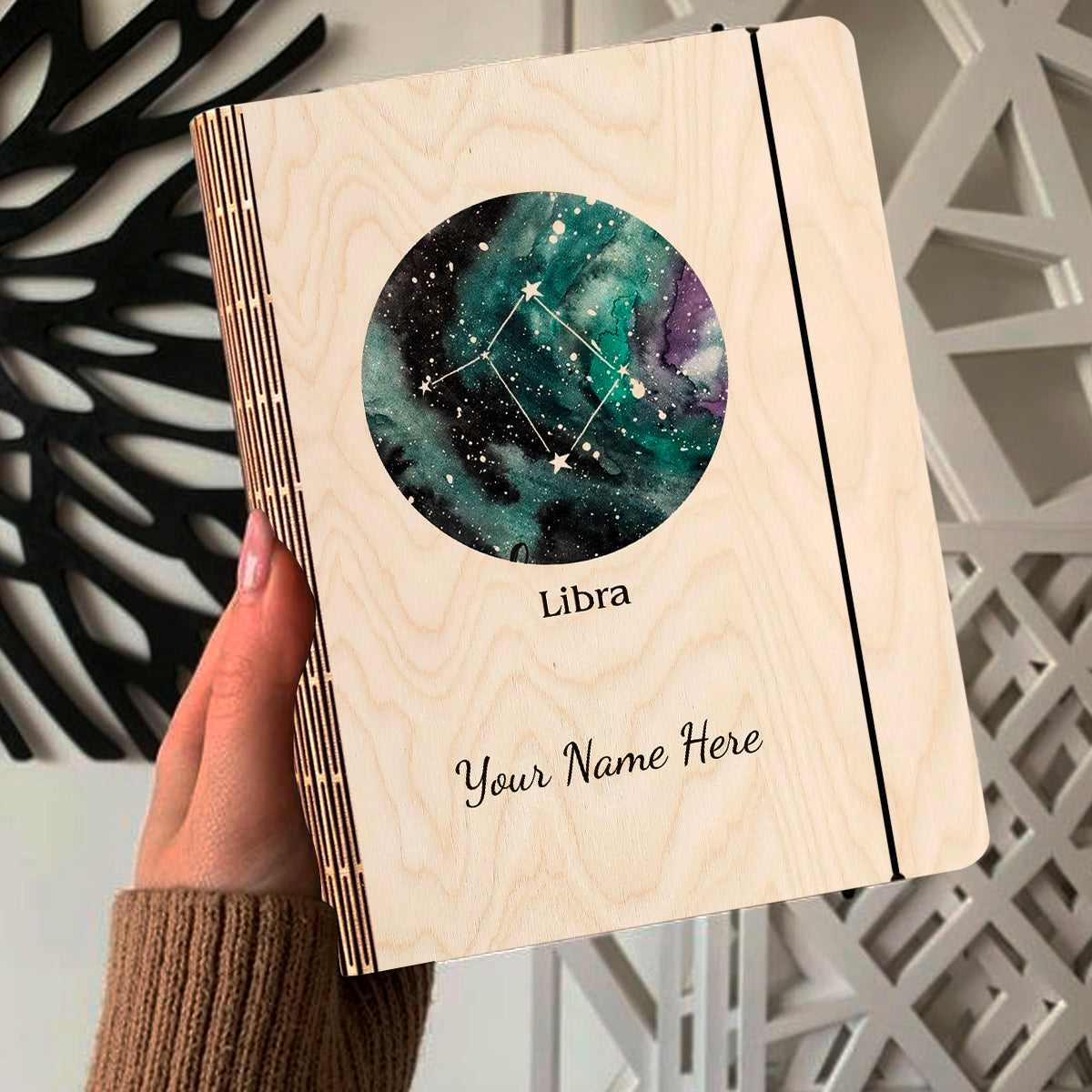 Open spread of the personalized diary, with teal-green nebula with Libra diamond-cluster constellation.