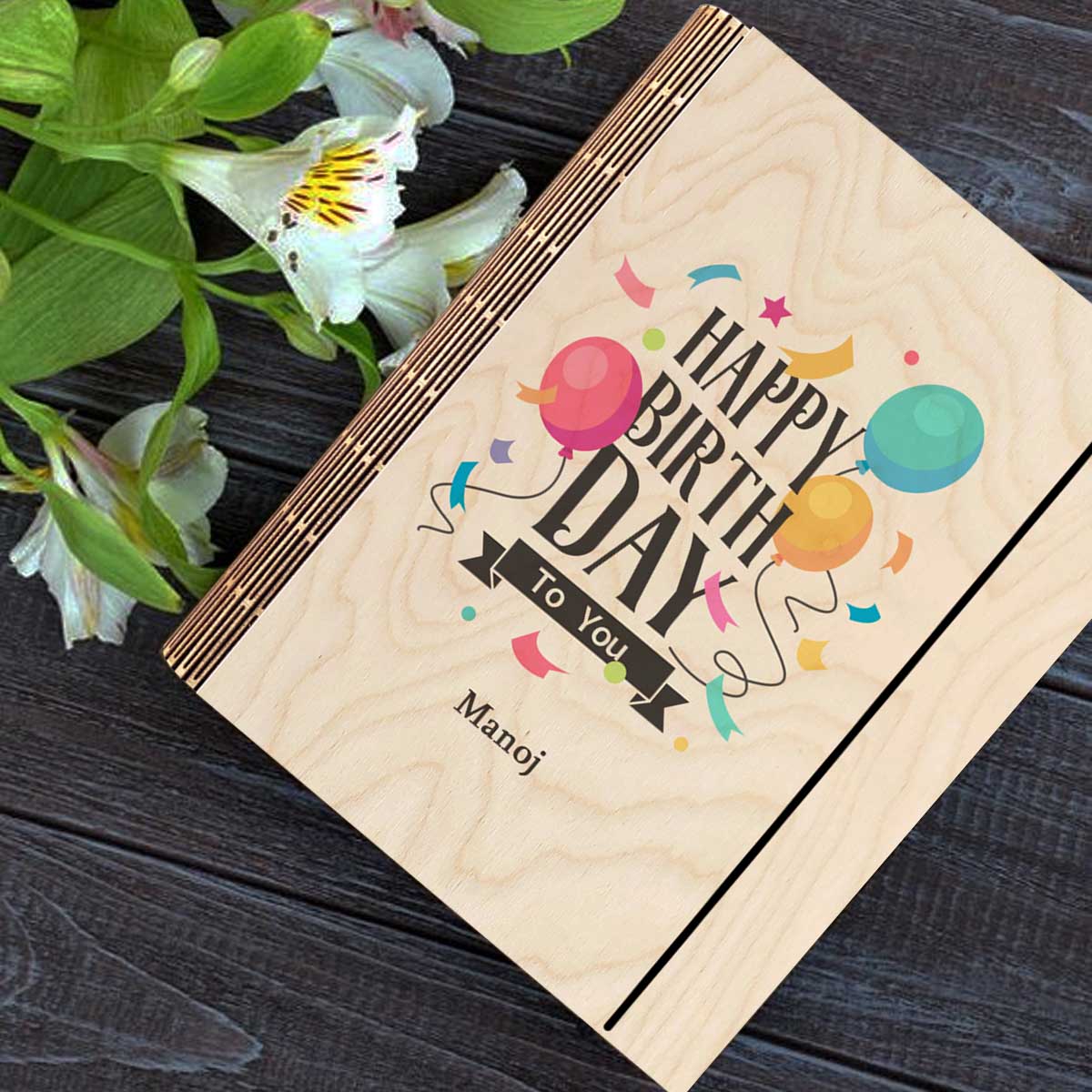 Personalized diary cover on a clean backdrop showing color-printed balloons + confetti with a custom name slot.