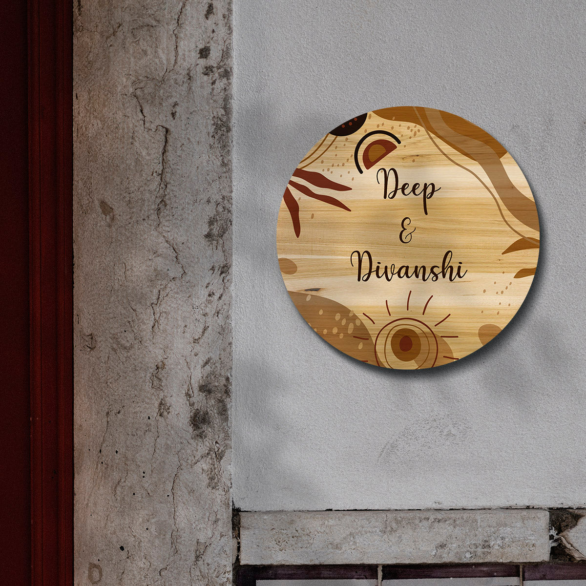 Rustic sun and leaf motifs on round couple name plate for home with script names