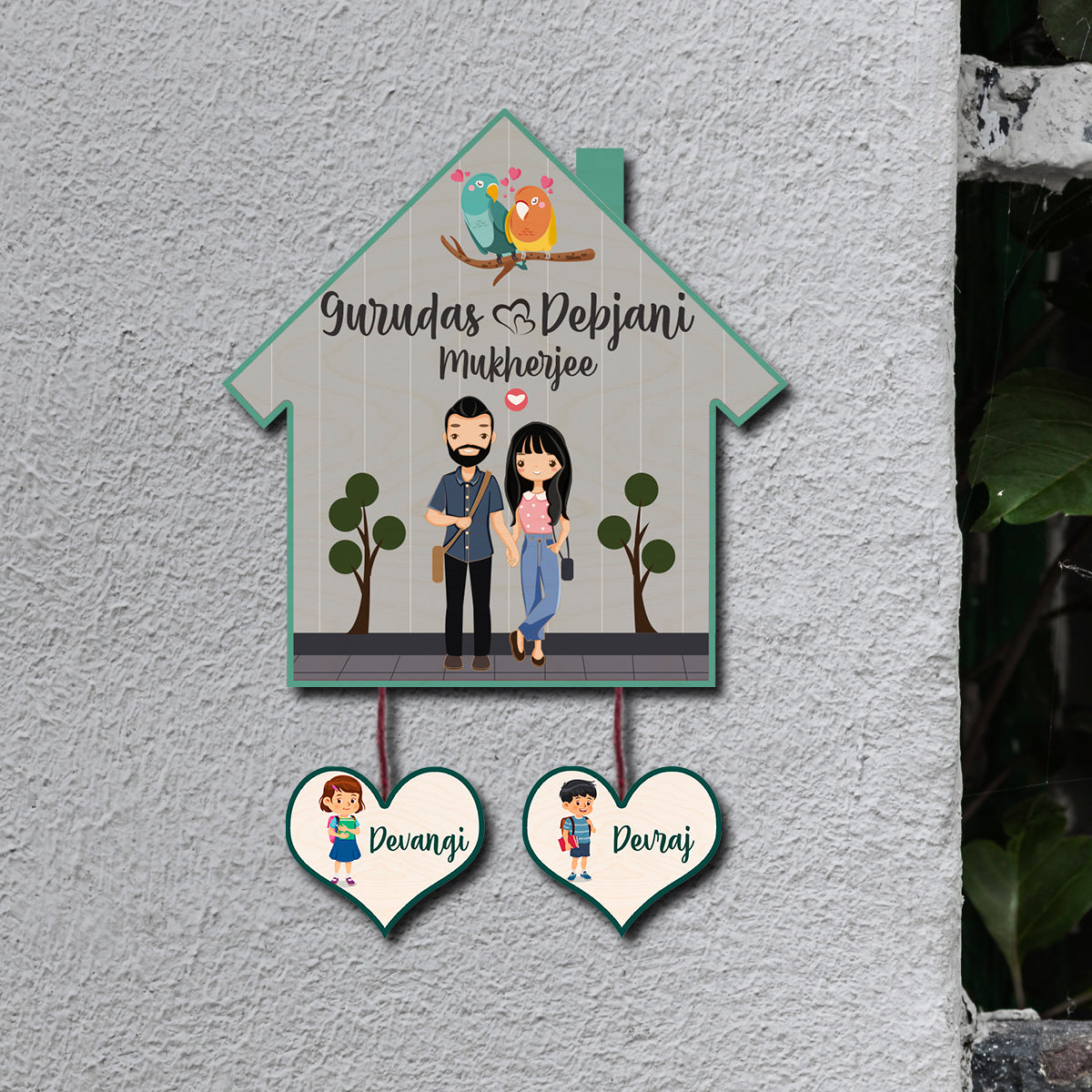 Hut shape family name plate with couple plus two kids on 10×14 birch