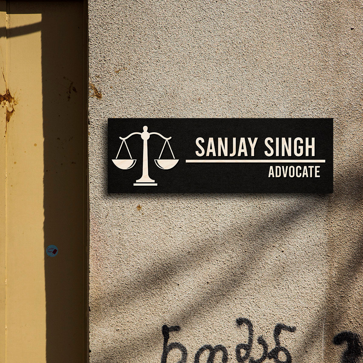 Advocate name plate for office with a scales-of-justice motif and name in bold caps