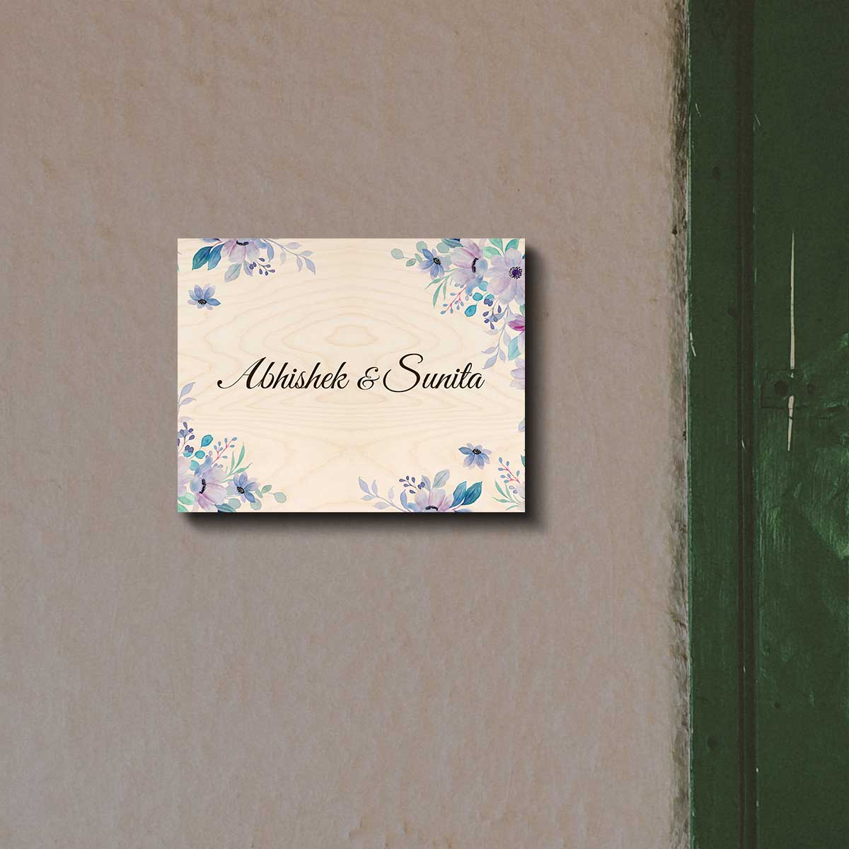 Name plate designs for flats with a name in cursive framed by purple watercolour flowers