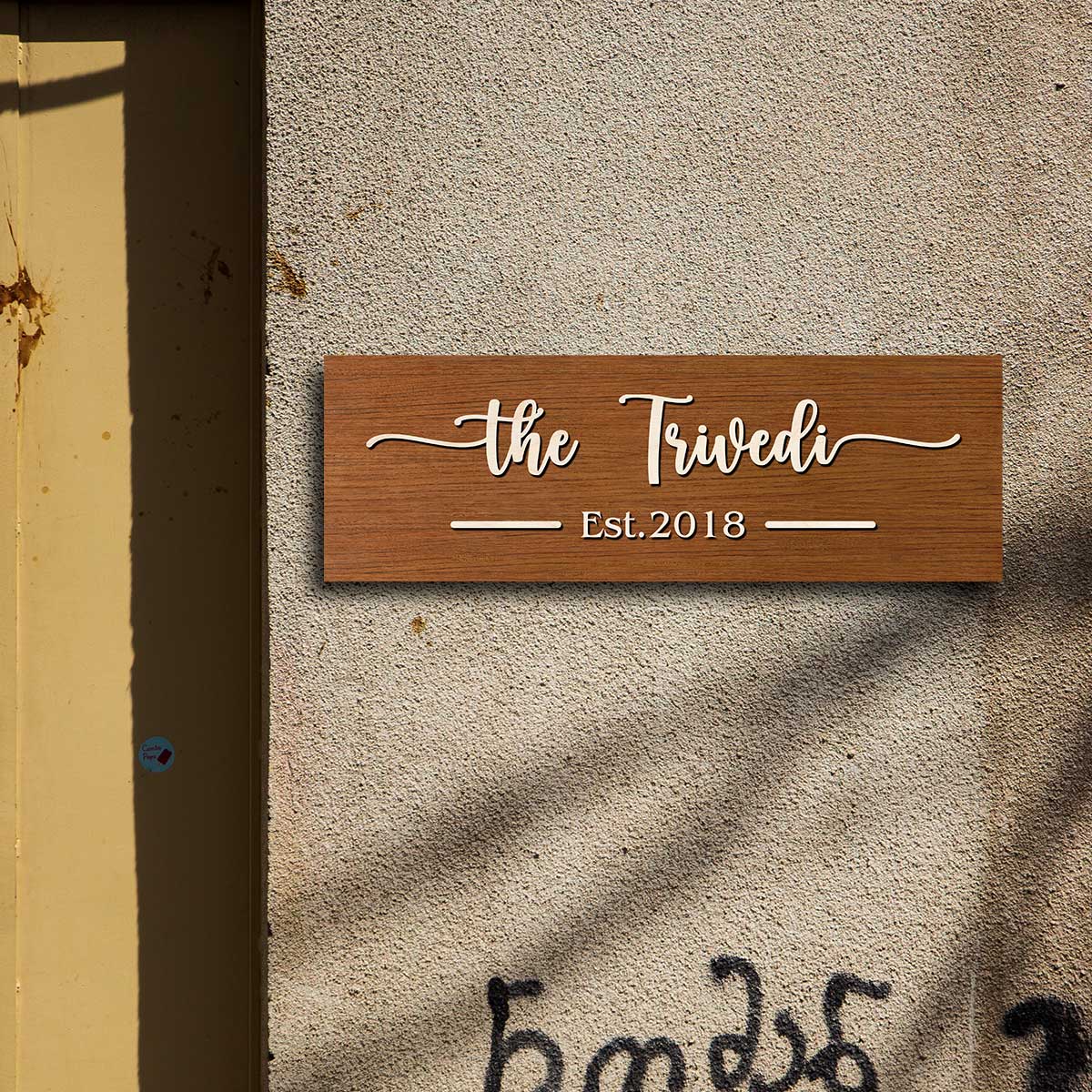 3D wooden name plate in brown birch styled on a family front door