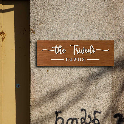 3D wooden name plate in brown birch styled on a family front door