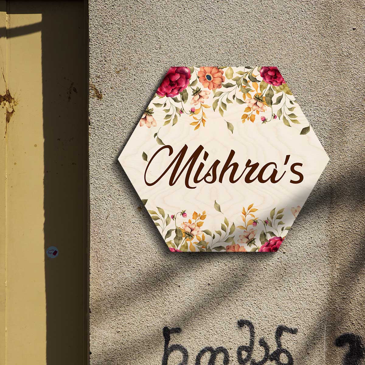 Hexagon floral name plate at home entrance with family name in warm brown script