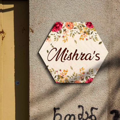 Hexagon floral name plate at home entrance with family name in warm brown script