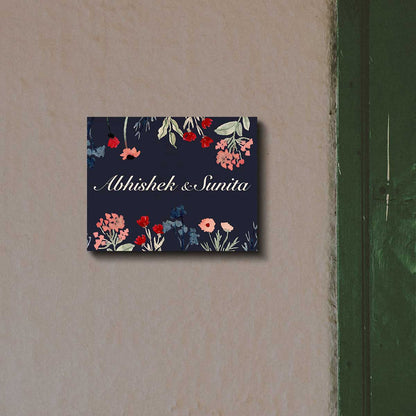 Navy wildflower print and white script couple names on dark floral couple name plate
