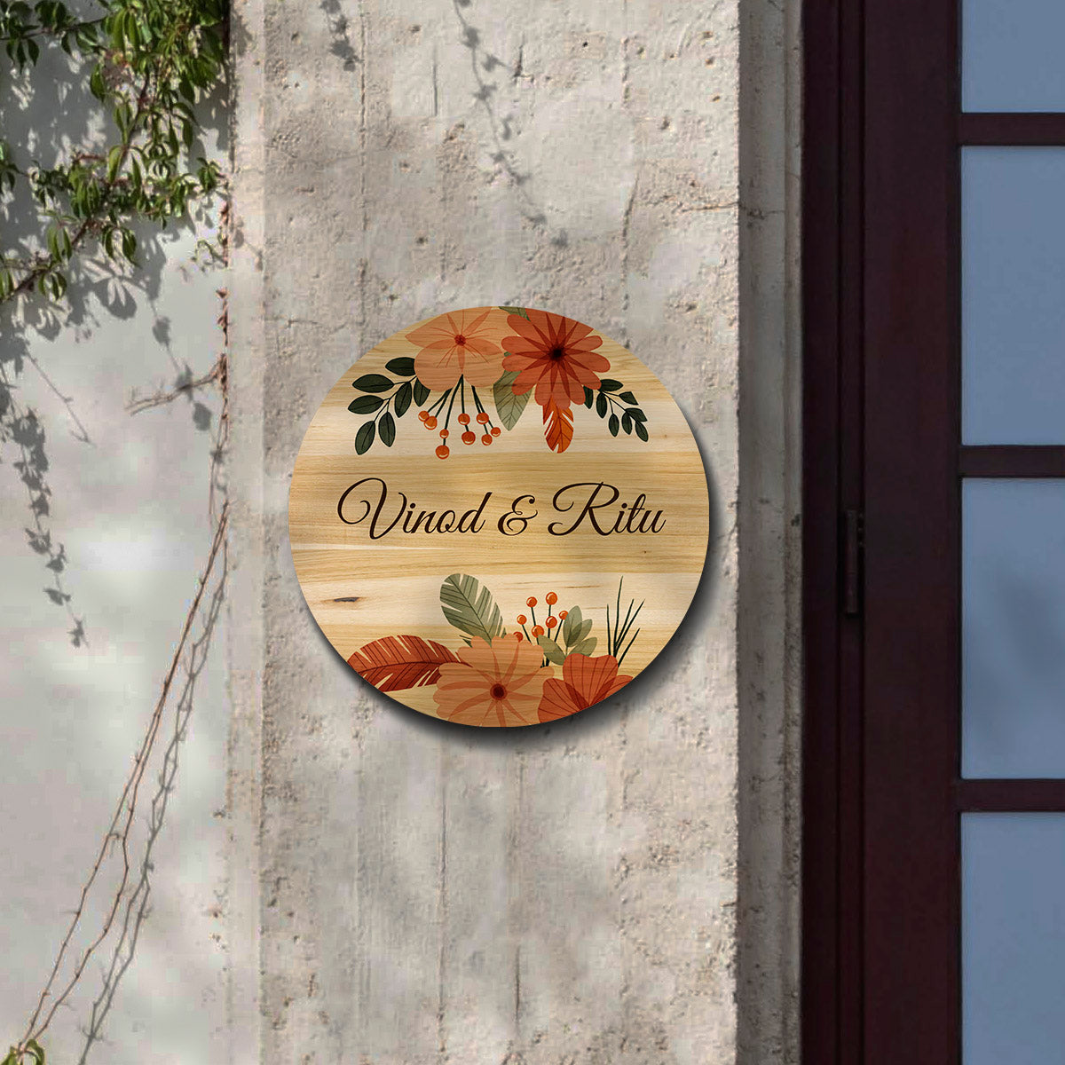 Close-up of boho floral motifs and berries on the round wooden nameplate over natural grain