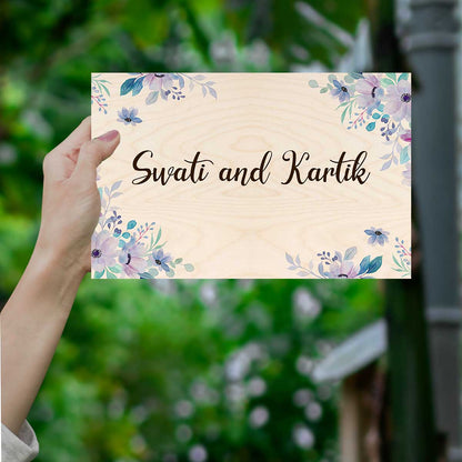 Ivory floral flat name plate on an apartment door with corner blooms