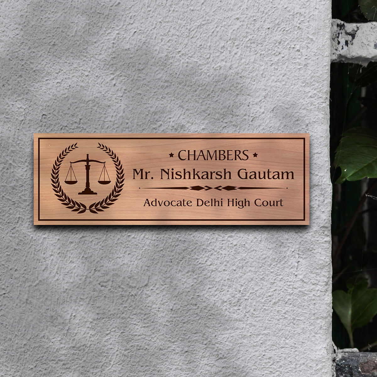 Close-up of the scales of justice and Chambers text on the advocate plate