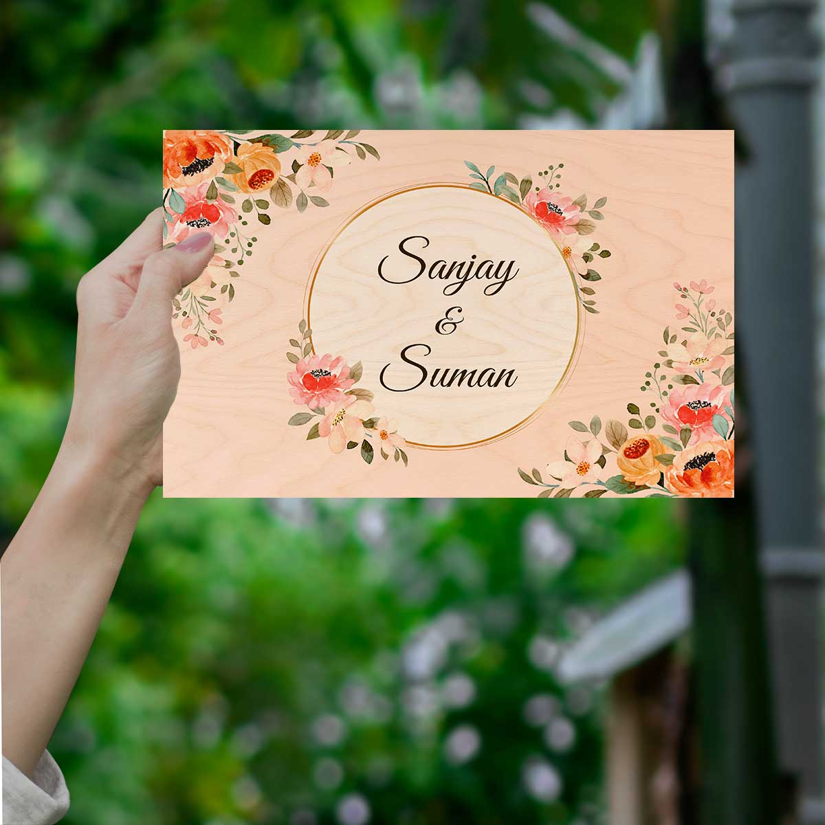 Name board for flat styled on apartment entrance with peach birch and gold circle