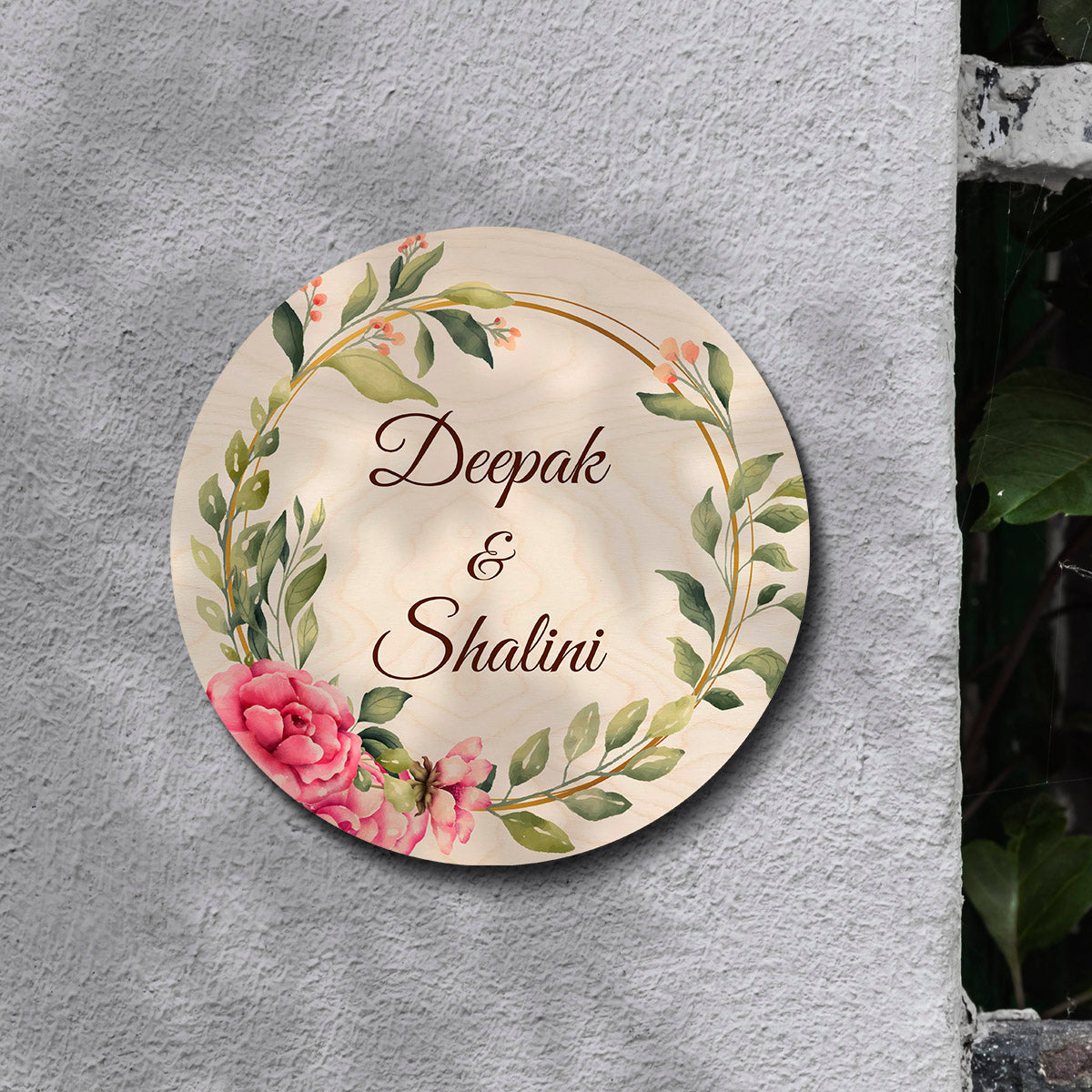 Personalised couple name plate with house number below the names on birch wood