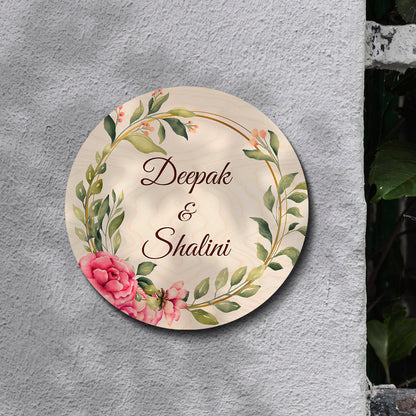 Personalised couple name plate with house number below the names on birch wood