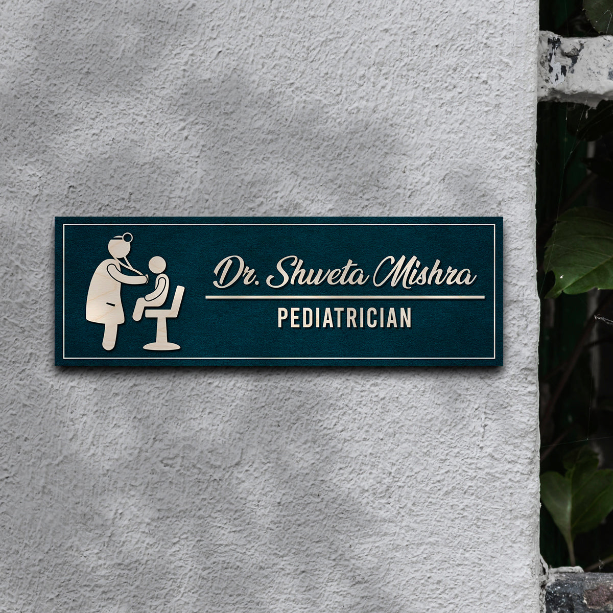 Close-up of pediatric icon showing a child with doctor on teal birch name plate